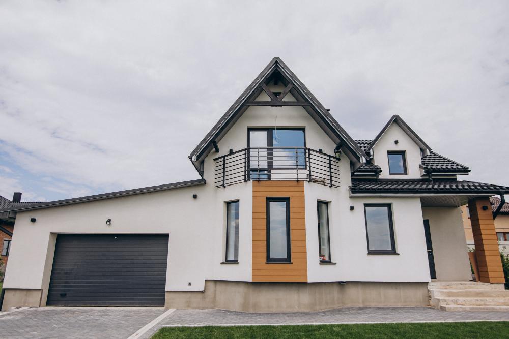 Two story California real estate house with white and wood exterior windows and balcony