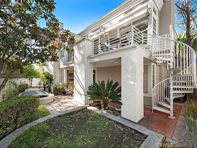 Two story California real estate house with spiral staircase garden and patio