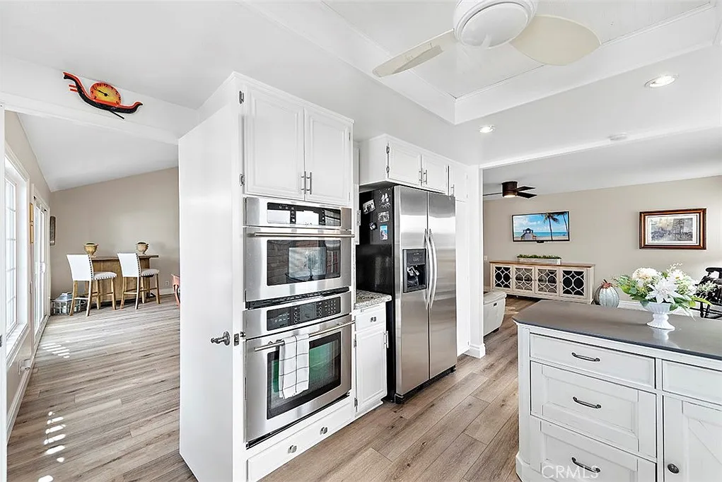 Kitchen with stainless steel appliances and white cabinets
