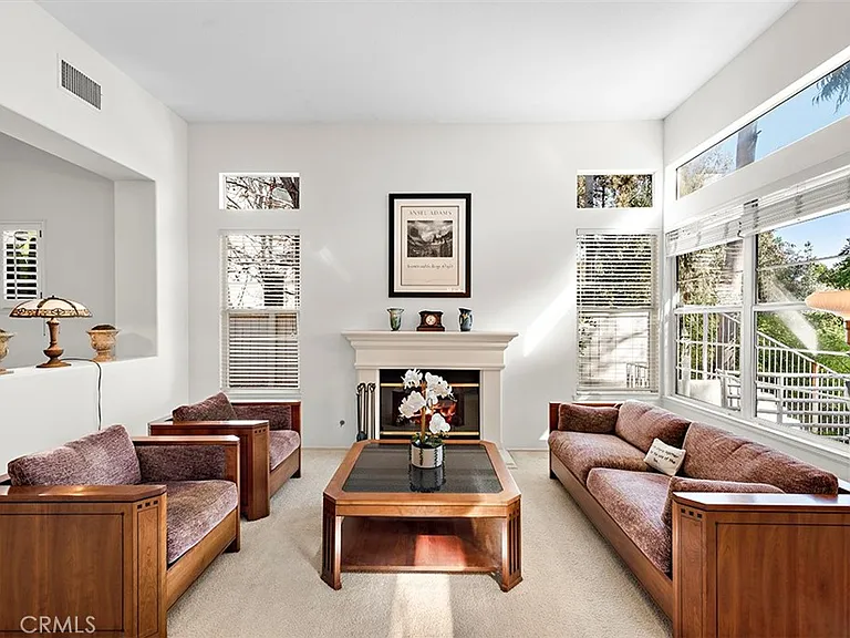 Living room with brown sofas coffee table and fireplace