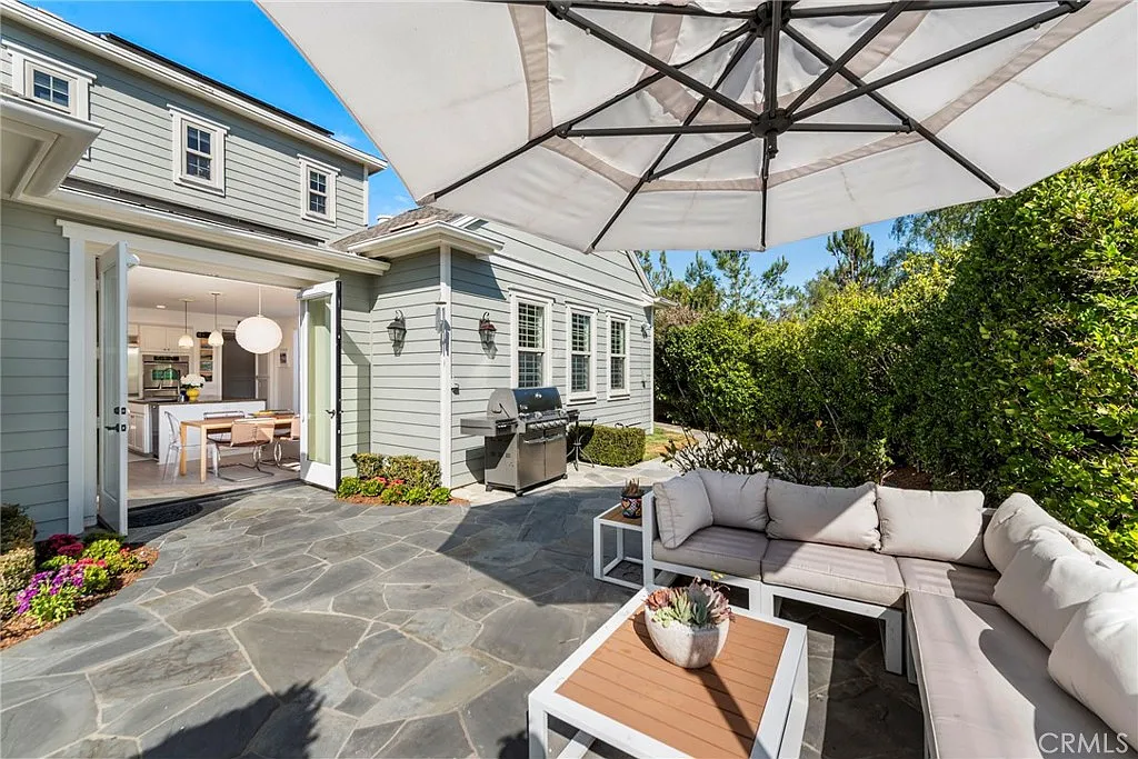 California real estate house patio with sectional couch coffee table and garden