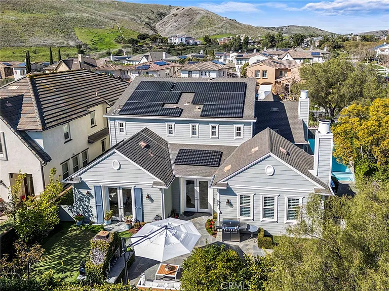 California real estate house with solar panels and trees