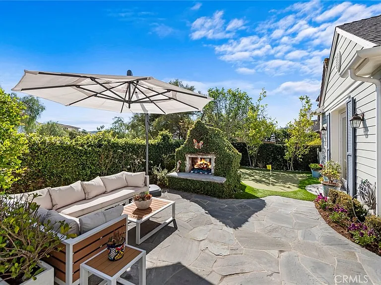 Patio with sofa umbrella fireplace