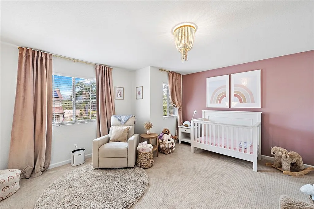 Nursery with crib chair and pastel walls