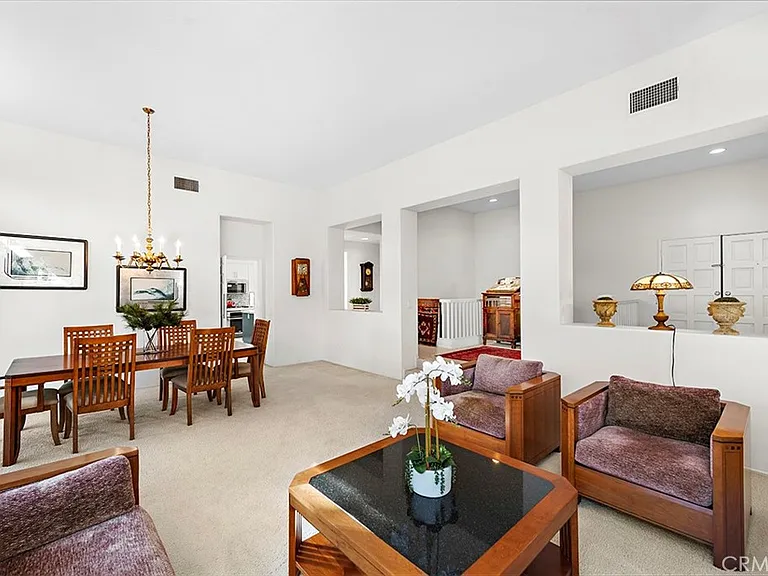 Living room with dining table chairs and seating