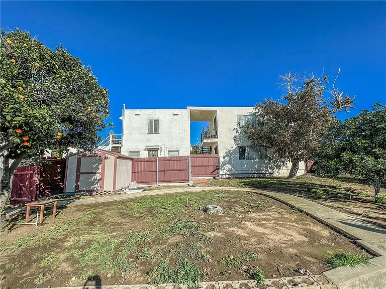 White two story building with trees