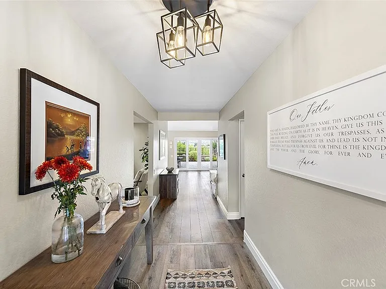 Hallway with table flowers and artwork